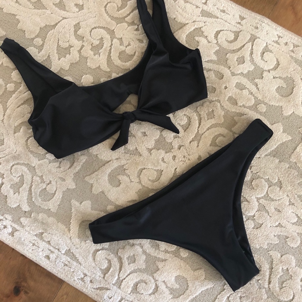 Brand new. Never worn. Black bikini.